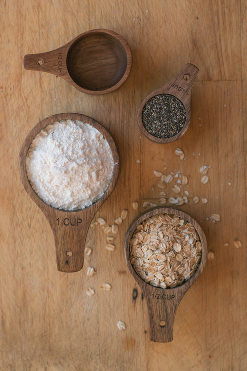 Wooden measuring cups with engraved measurements