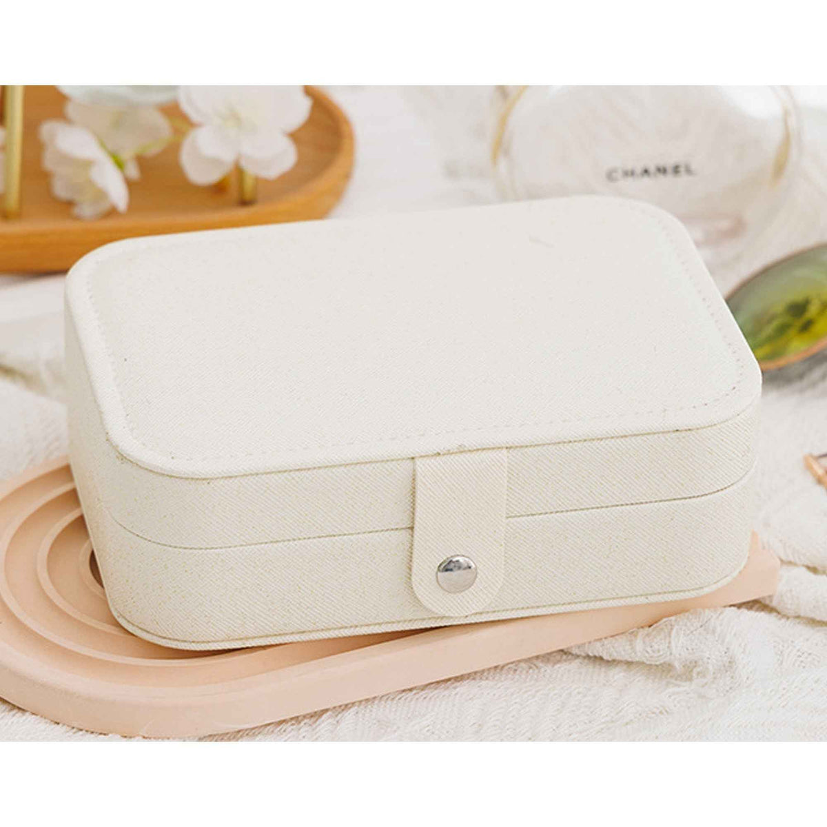 Portable jewelry case with ring rolls earring panel and necklace hooks
